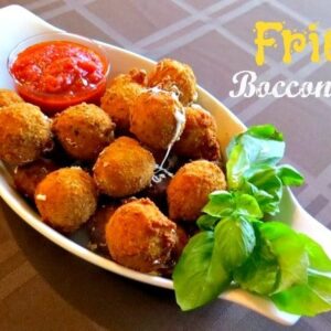 fried Bocconcini in a serving dish with sauce