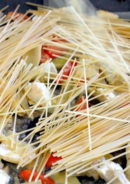 pasta in skillet for shrimp and artichoke pasta
