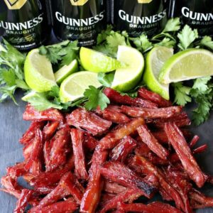 Shredded corned beef with limes and Guinness beer cans