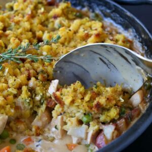 Skillet Chicken Pot Pie with Cornbread Topping is a one pan chicken dinner recipe with cornbread stuffing