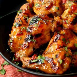 Slow Cooker Sweet Chili Chicken Wings in a black dish