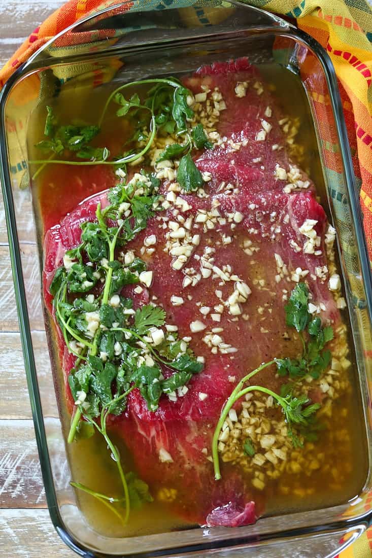 Flank steak in dish with marinade