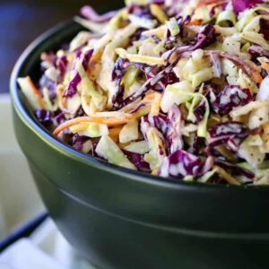 Coleslaw in a black bowl from the side