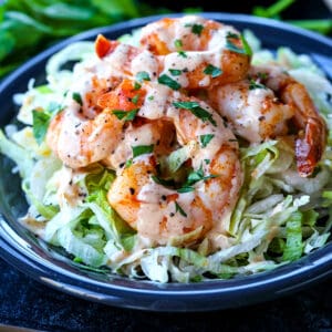 Shrimp Remoulade recipe over lettuce on gray plate