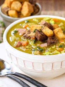 bowl of split pea and ham soup with croutons