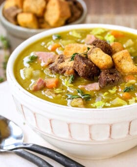 bowl of split pea and ham soup with croutons