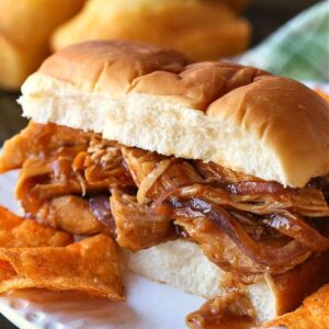 slow cooker chicken on a bun with potato chips