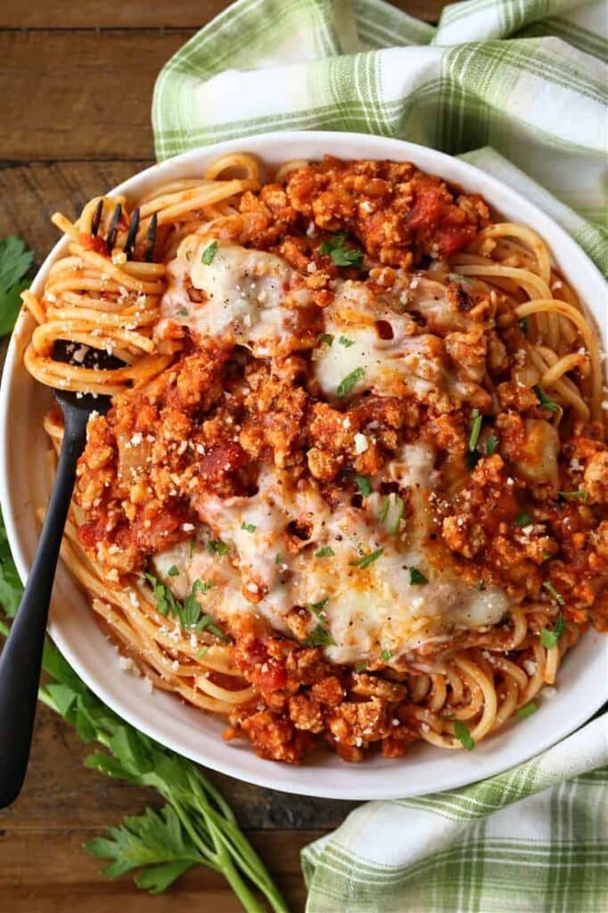 Ground chicken recipe served over spaghetti