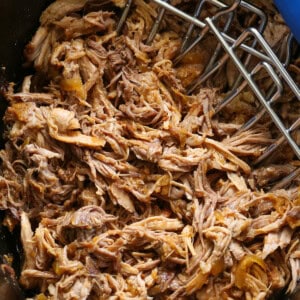 pulled pork in a slow cooker with meat claws