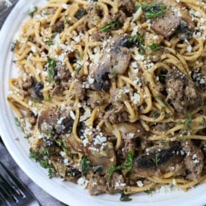 Beef and Mushroom Spaghetti on a plate with forks