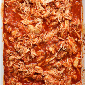 shredded chicken in a slow cooker with marinara sauce