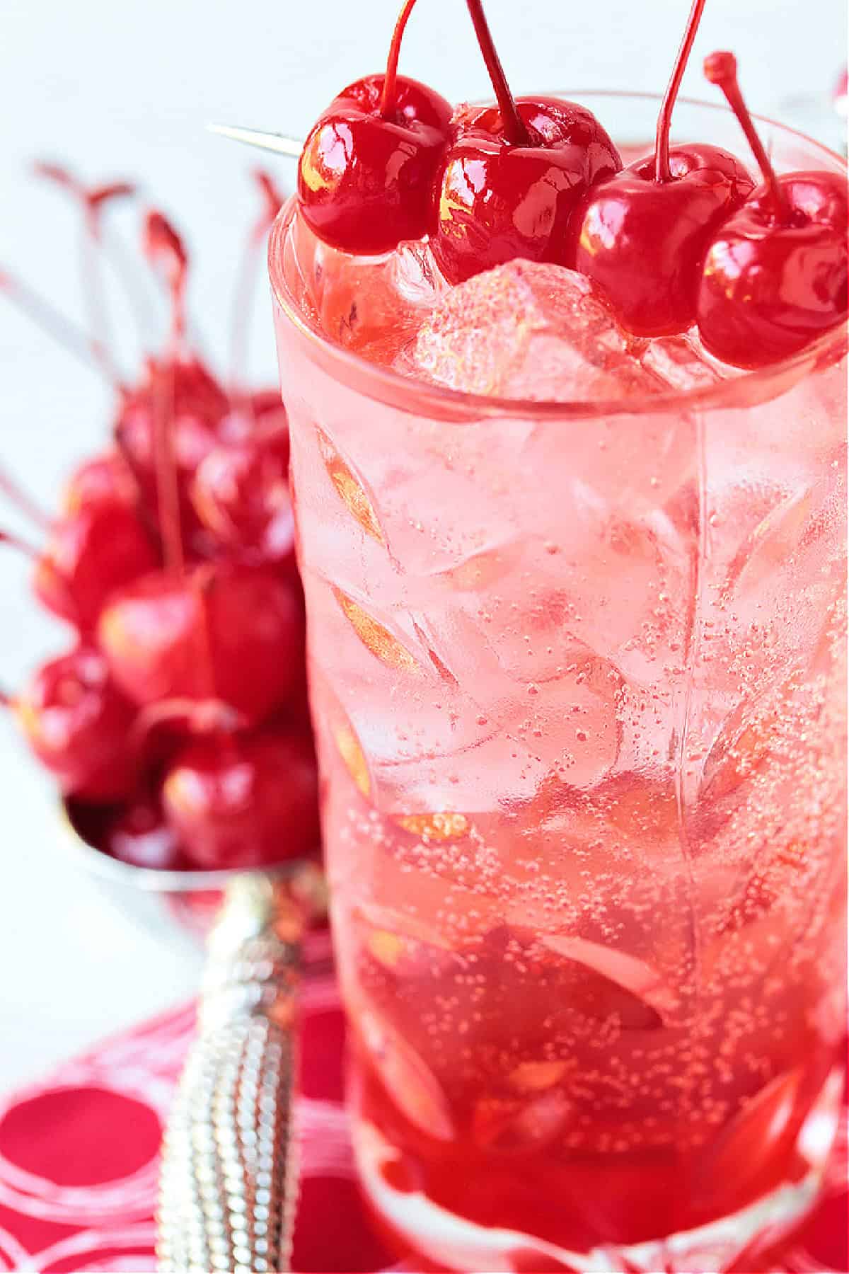 dirty shirley cocktail with cherry garnish