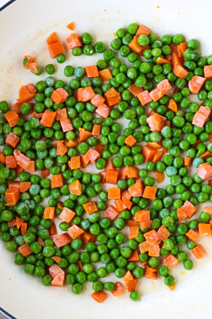 peas and carrots in a skillet