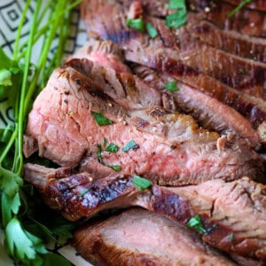 sliced flank steak with chopped parsley
