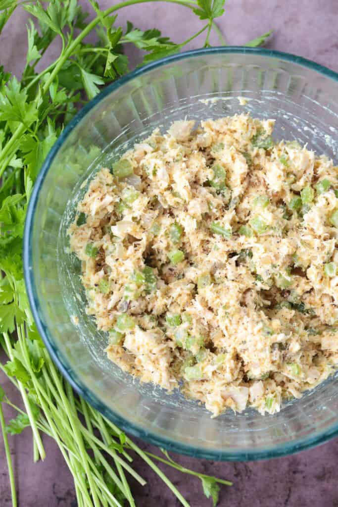 tuna fish mixture in a glass bowl with parsley