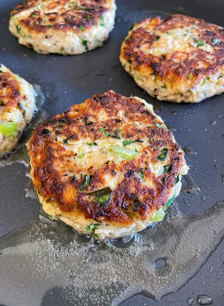 cooked tuna cakes in skillet