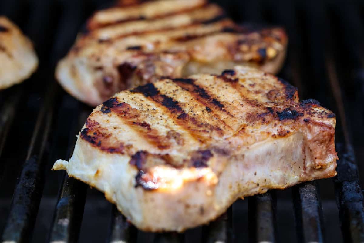 grilled pork chops on a grill