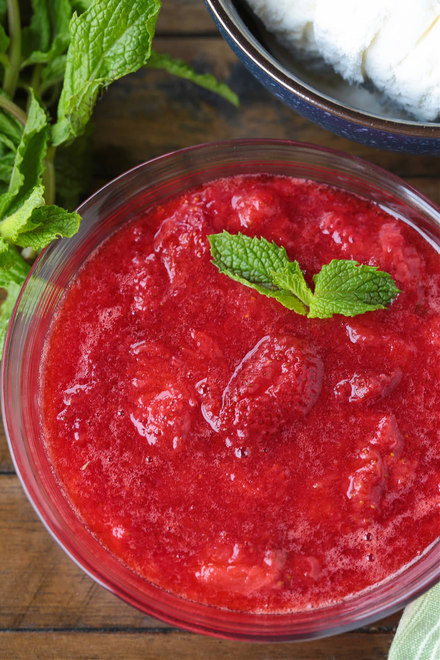 strawberry compote in a bowl with mint