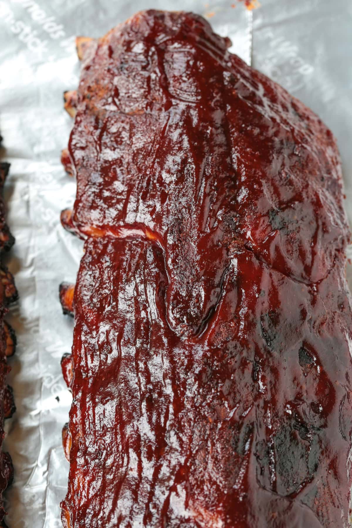 slab of barbecue ribs on foil
