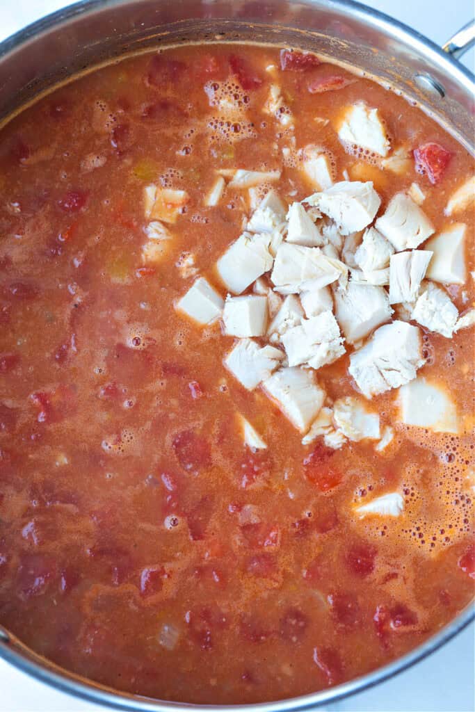 soup in a pot with diced chicken