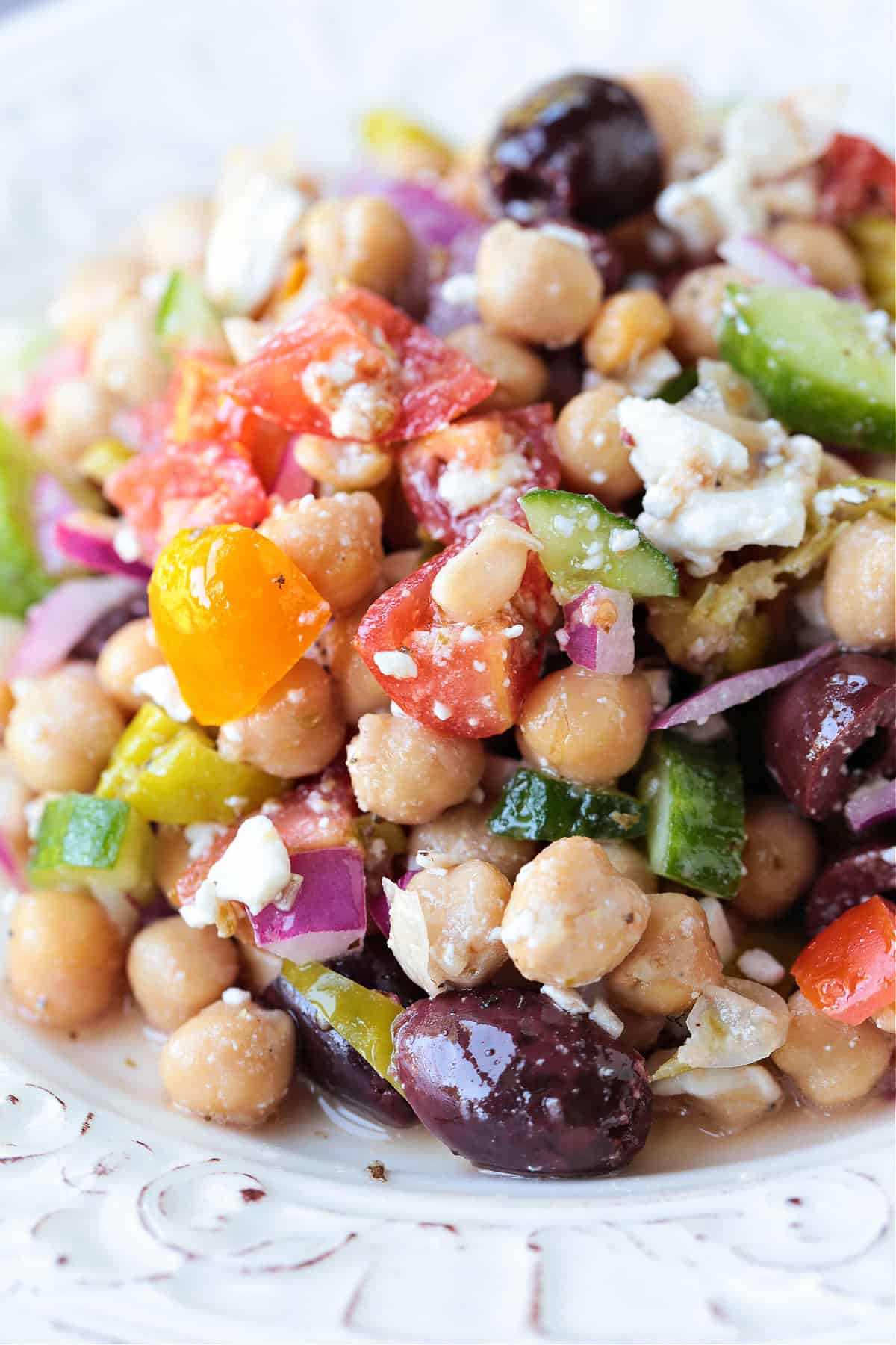 chickpea salad with vegetables on a white plate