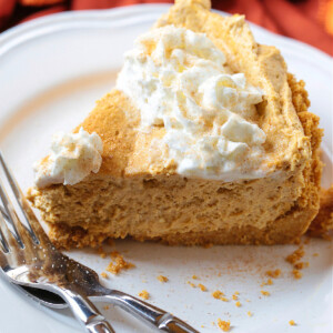 slice of no bake pumpkin pie on plate with forks