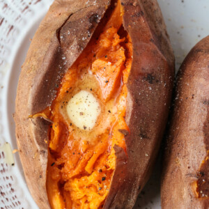 sweet potato cut down the middle with butter