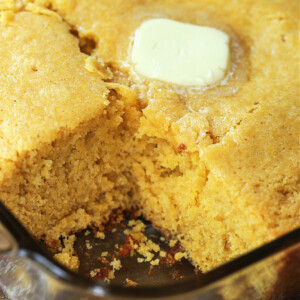 cornbread in a baking dish with a square cute out