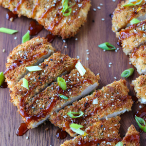 chicken katsu sliced and drizzled with sauce and scallions