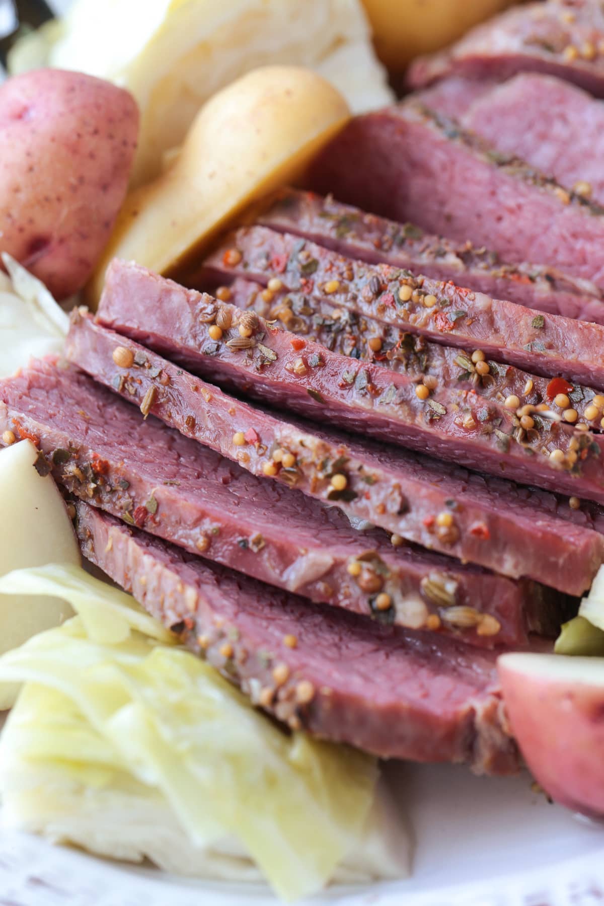 sliced corned beef and cabbage on platter close up