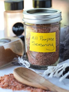 all purpose seasoning in mason jar with spice jars