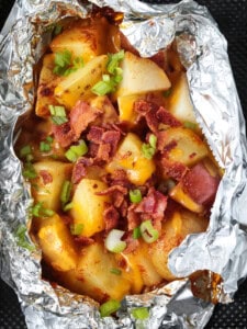 potatoes in a foil packet with cheese and bacon