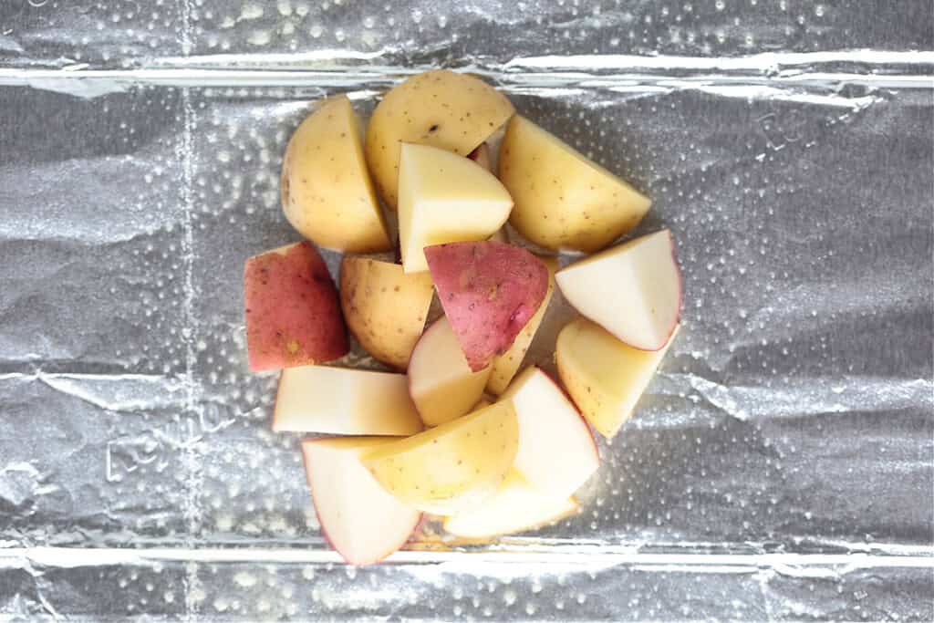 diced potatoes on aluminum foil