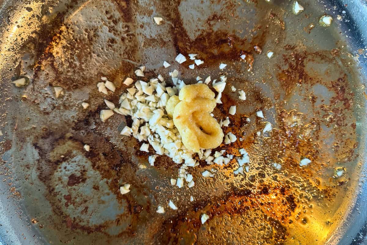 garlic and ginger in skillet with oil