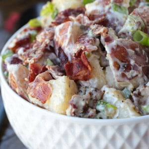 ranch potato salad in white bowl form the side