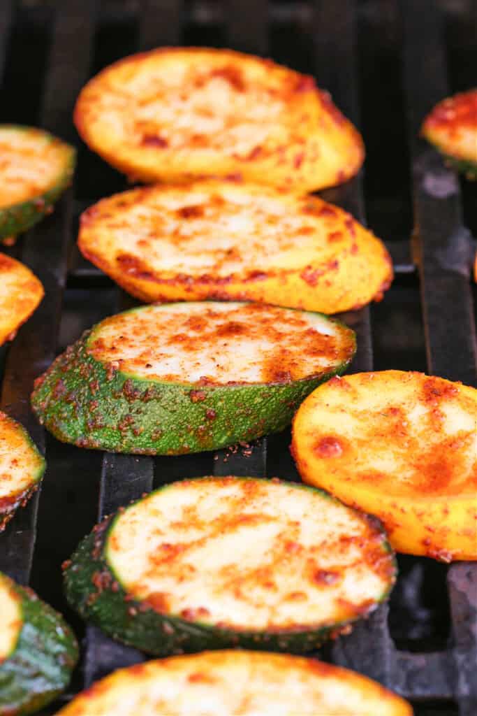 seasoned slices of zucchini and squash on grill