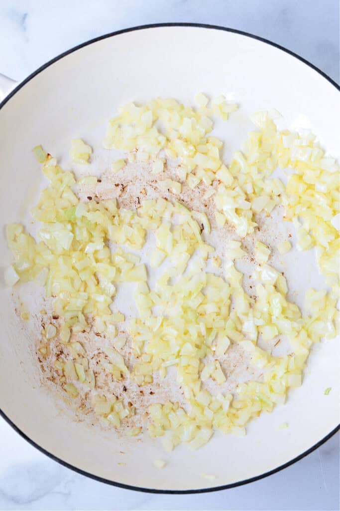 diced onions cooked in a skillet