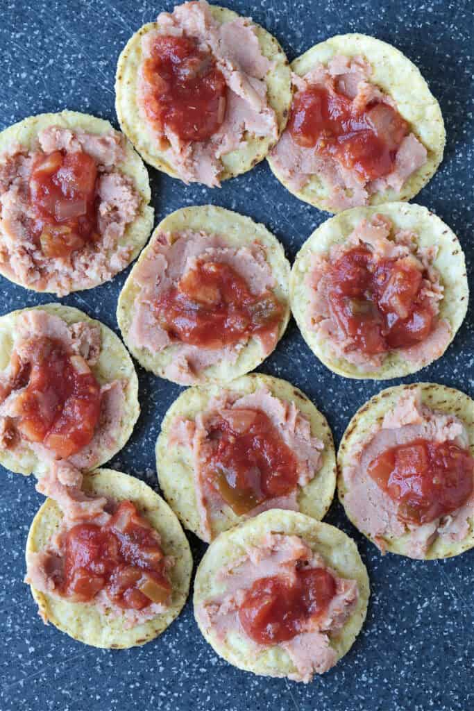 salsa and refried beans on tortilla chips