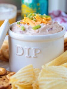 dip in a dip bowl with chips on the side