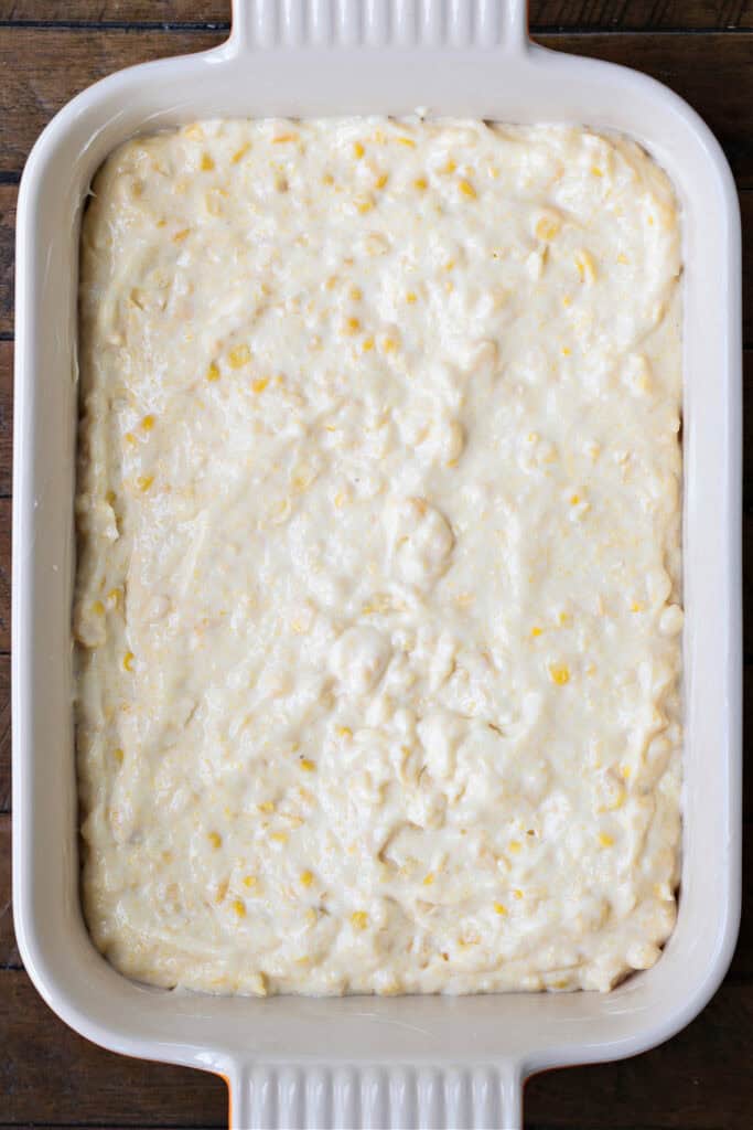 casserole dish with corn souffle batter ready for baking