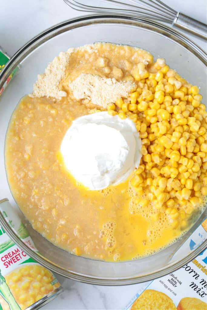 corn, sour cream and other ingredients in glass bowl