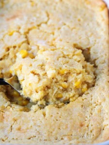 spoon scooping into corn casserole