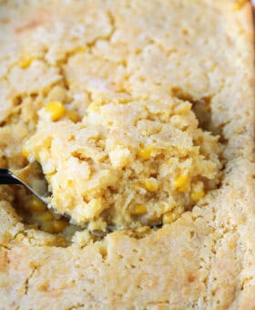 spoon scooping into corn casserole