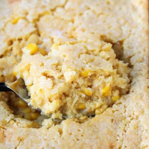 spoon scooping into corn casserole