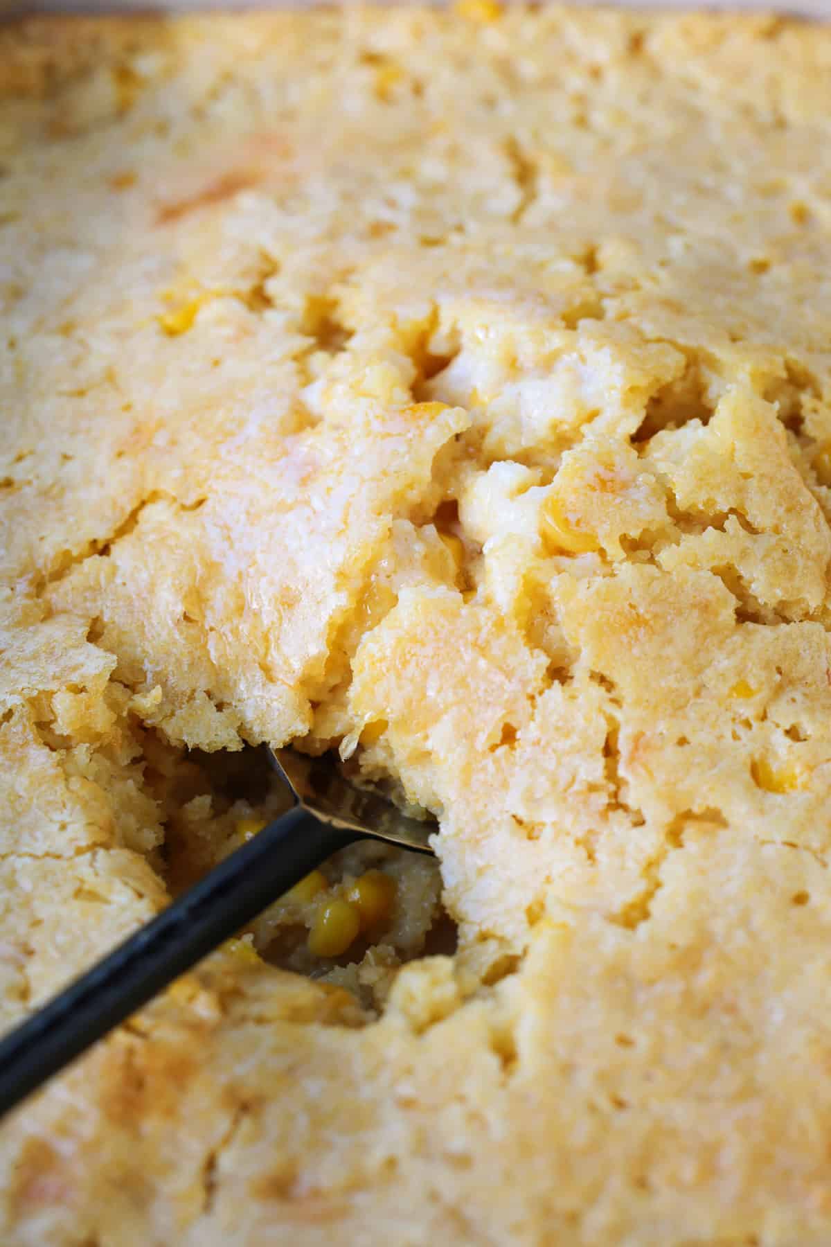 corn souffle with a spoon in the middle