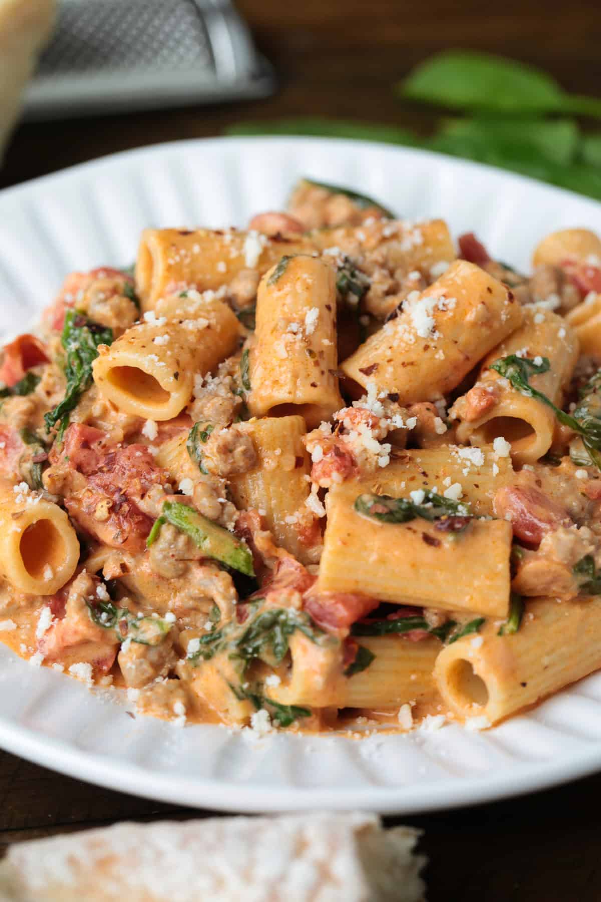 rigatoni recipe in pink cream sauce on a white plate