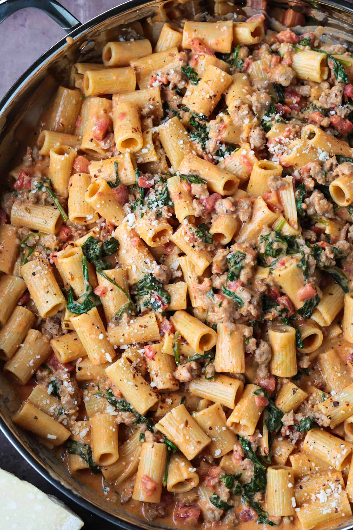 pasta with sausage in a pink cream sauce in large skillet