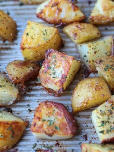 crispy roasted potatoes on baking sheet with ranch seasoning