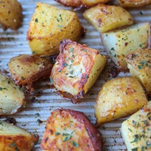 crispy roasted potatoes on baking sheet with ranch seasoning