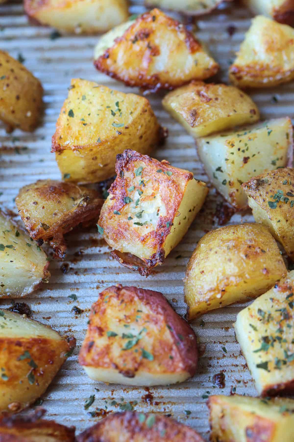 crispy roasted potatoes on baking sheet with ranch seasoning